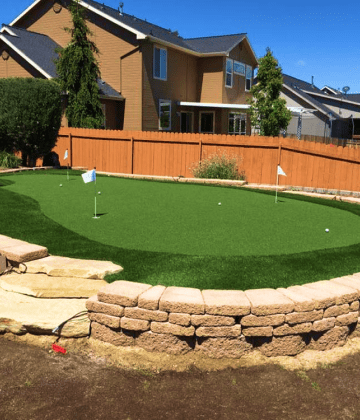 This impeccable Three Hole Putting Green is made possible with a retaining feature & steps